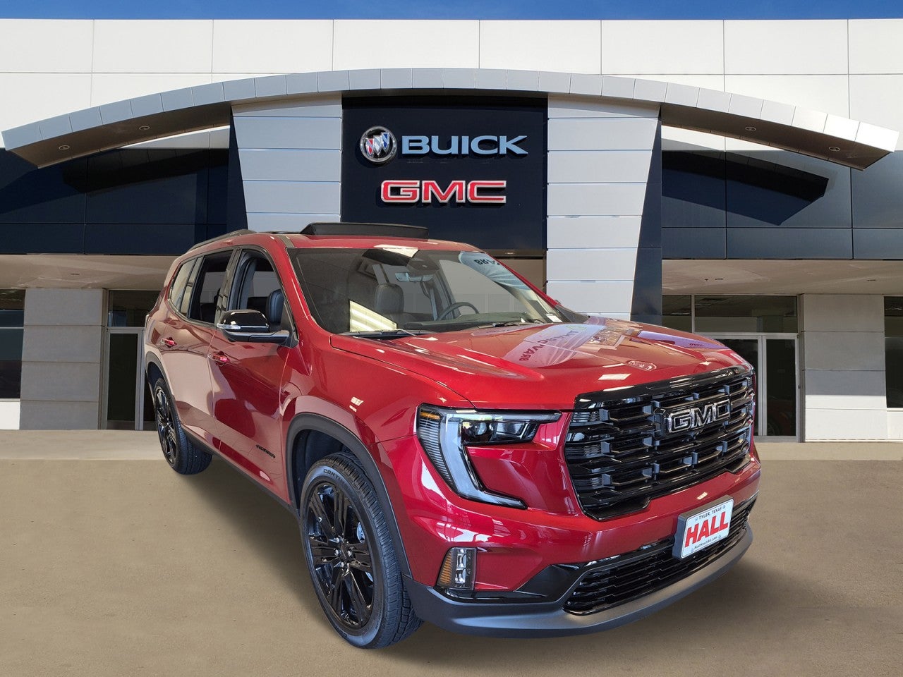 2026 GMC Acadia Elevation in Volcanic Red Tintcoat — front three-quarter view