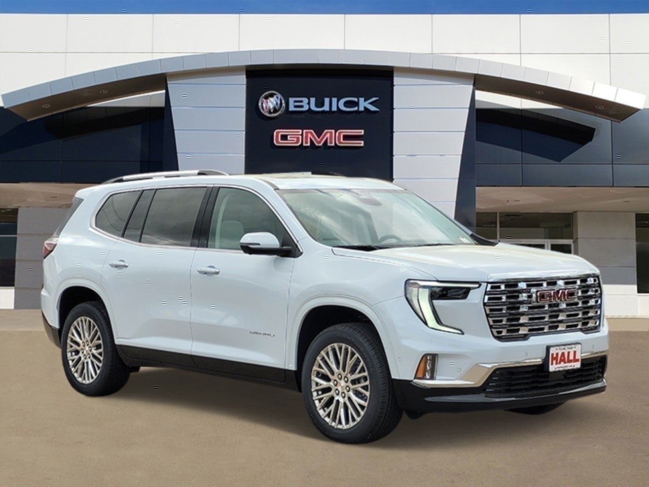 2026 GMC Acadia Denali in Glacier White Tricoat — front three-quarter view