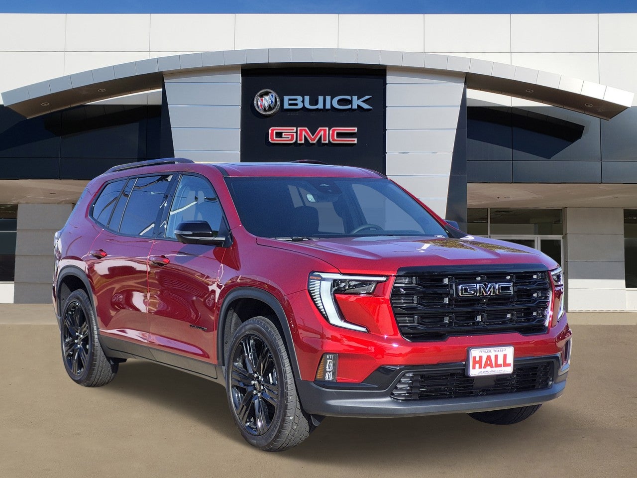 2026 GMC Acadia Elevation in Volcanic Red Tintcoat — front three-quarter view