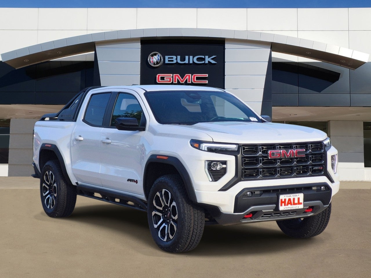 2025 GMC Canyon AT4 in Summit White — front three-quarter view