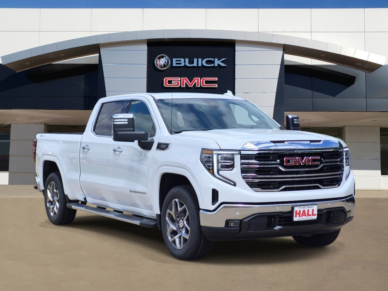 2026 GMC Sierra 1500 SLT in Summit White — front three-quarter view