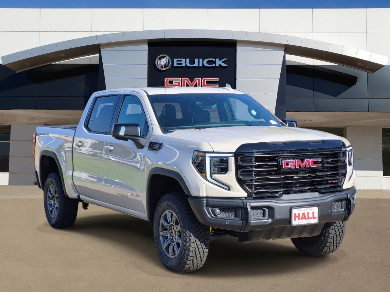 2026 GMC Sierra 1500 AT4X in Coastal Dune — front three-quarter view