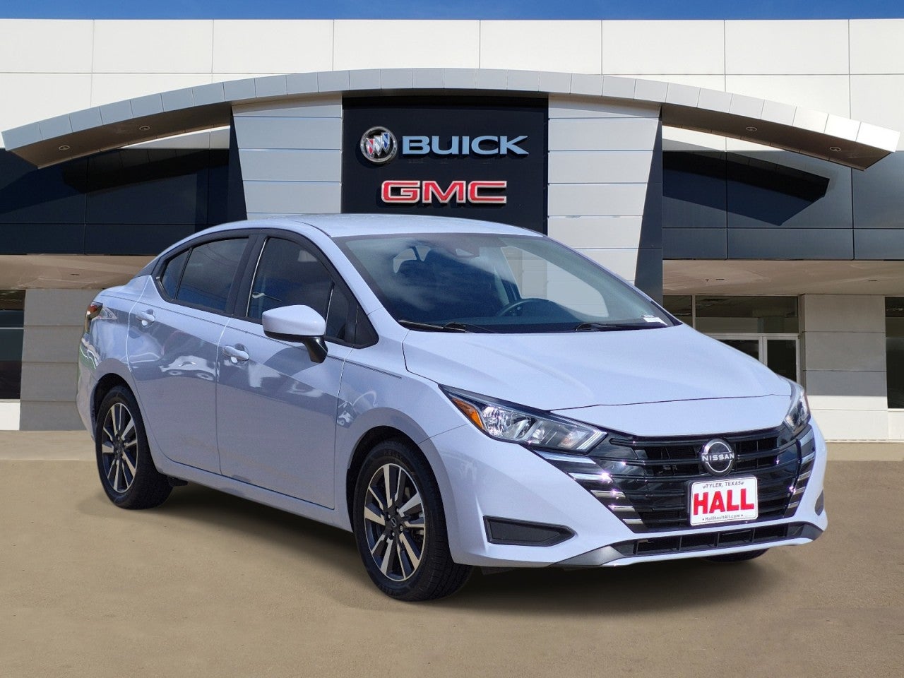 2023 Nissan Versa SV in White — front three-quarter view