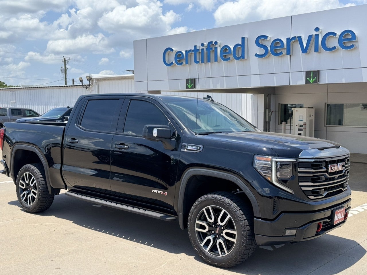 2024 GMC Sierra 1500 AT4 in Onyx Black — front three-quarter view